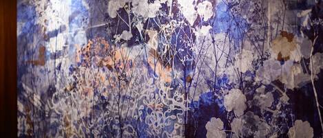 A wall with a floral pattern.