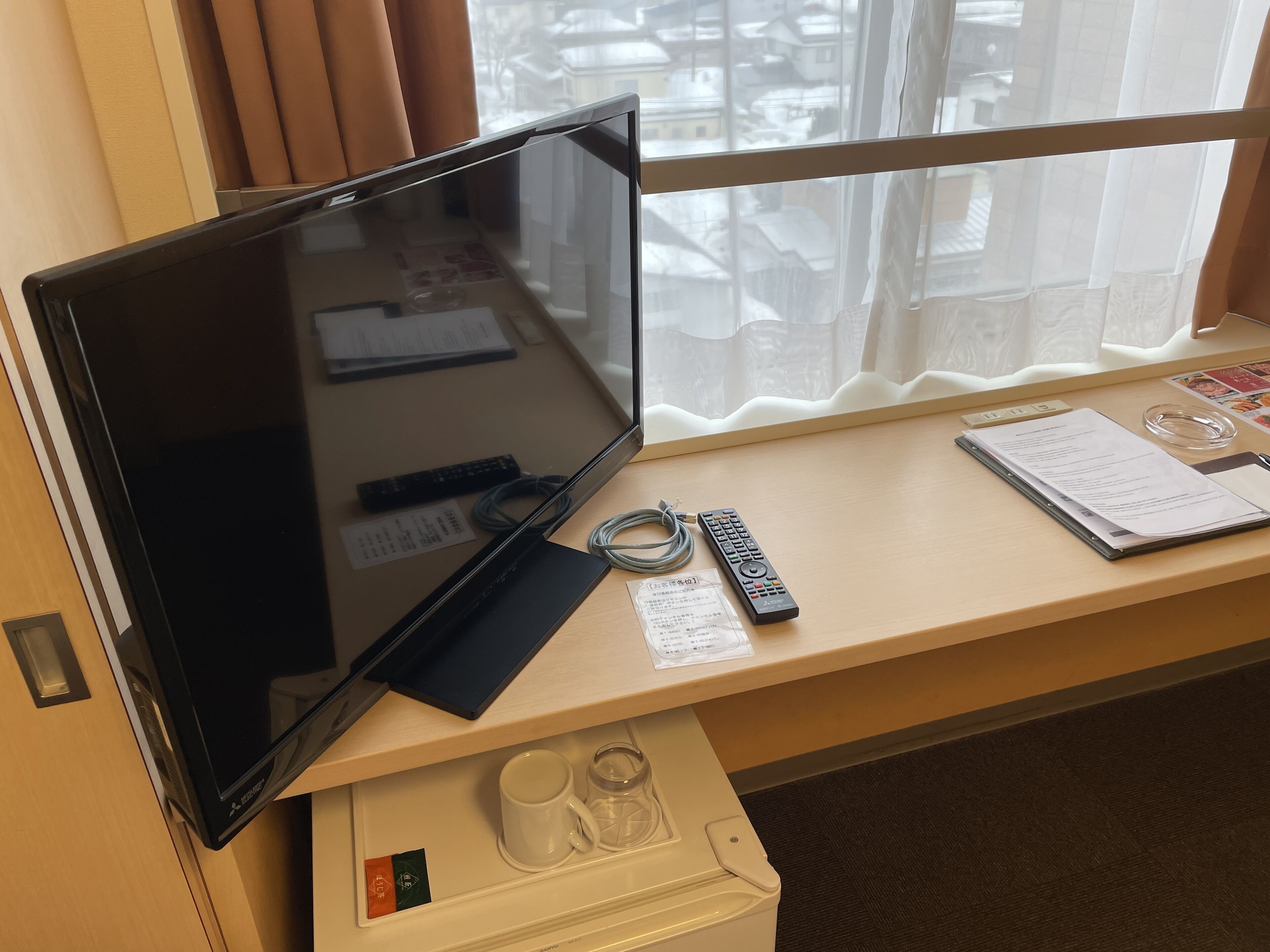 desk, laptop workspace, blackout curtains, iron/ironing board