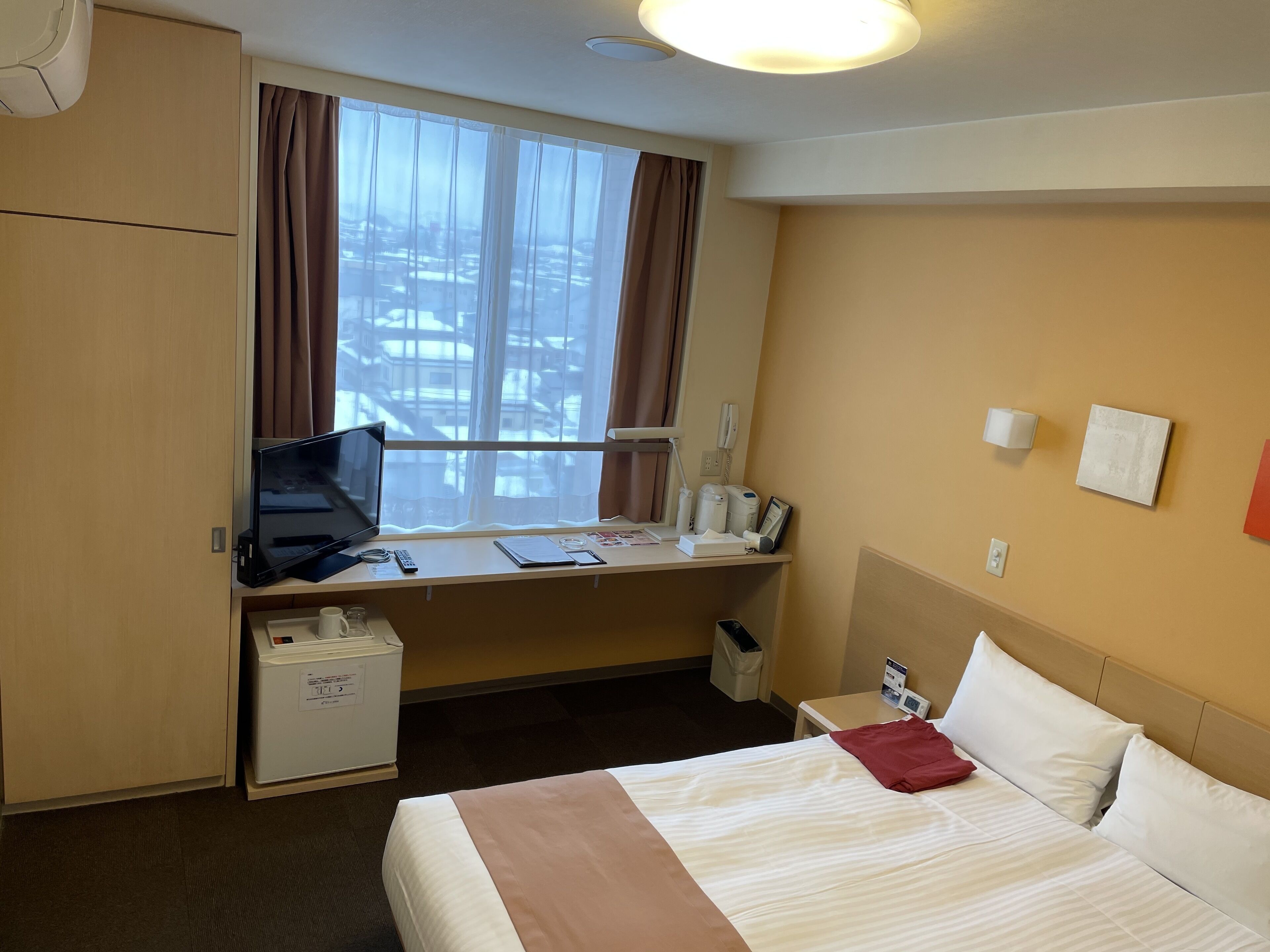 desk, laptop workspace, blackout curtains, iron/ironing board