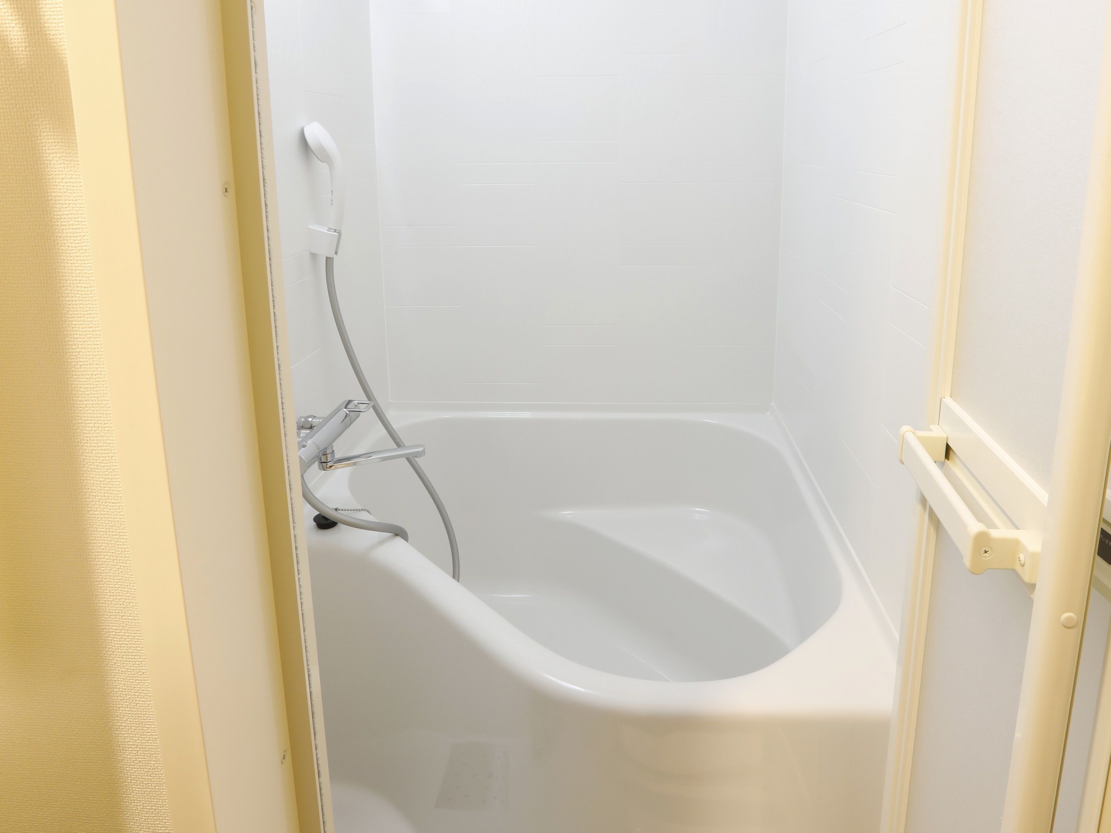 separate bathtub and shower, hair dryer, slippers, electronic bidet