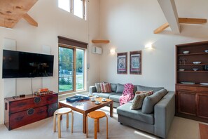 Chalet, 4 Bedrooms | Living area | Flat-screen TV, DVD player