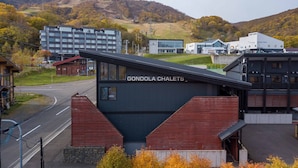 A modern building with a sign reading "Gondola Chalets." - Gondola Chalets (Kutchan)