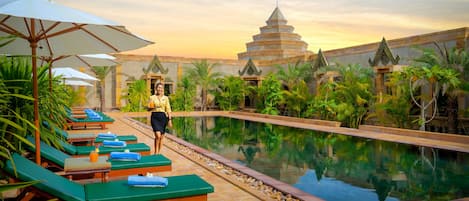 2 outdoor pools, open 7 AM to 9 PM, pool umbrellas, pool loungers
