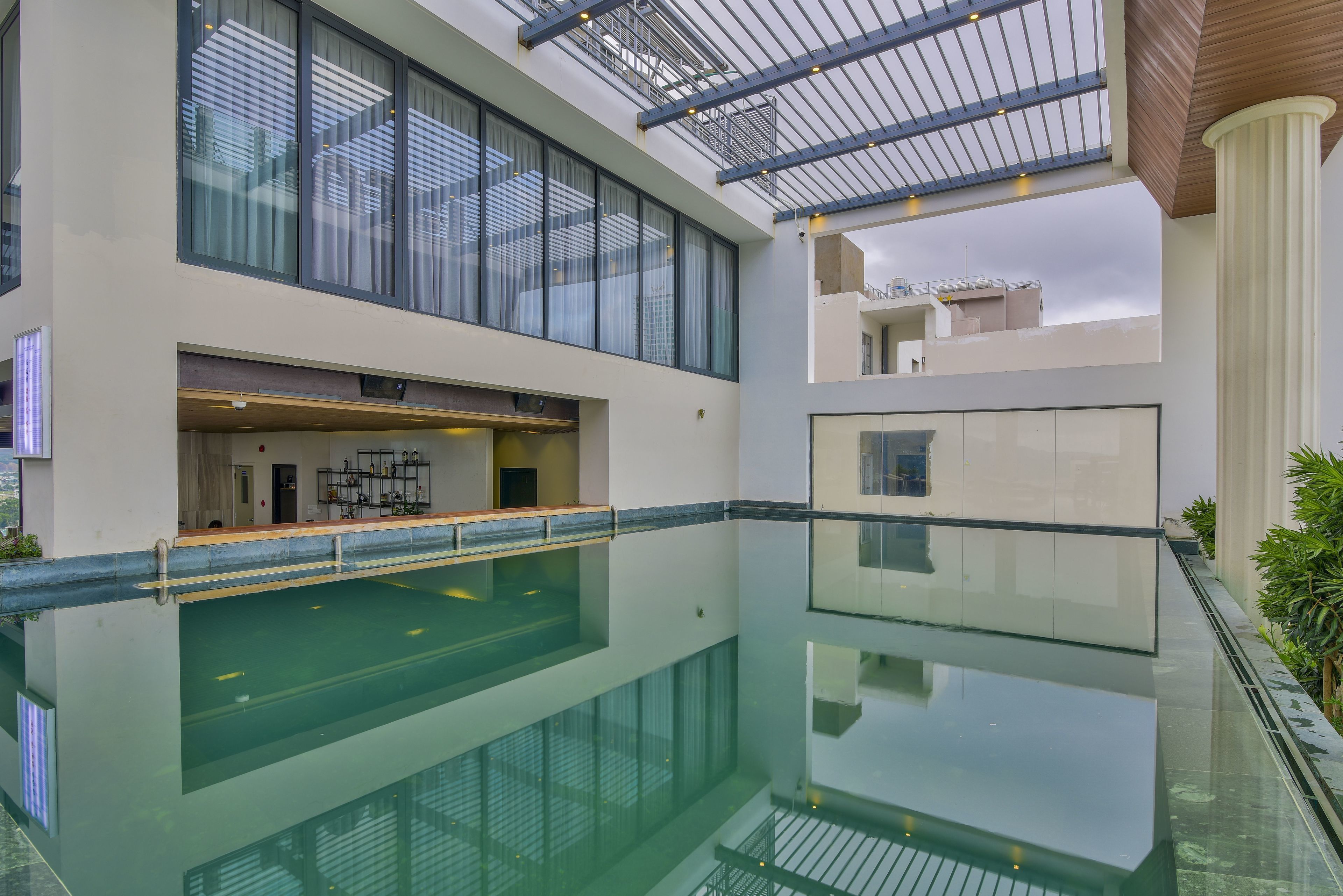Outdoor pool, open 6:00 AM to 6:00 PM, pool loungers
