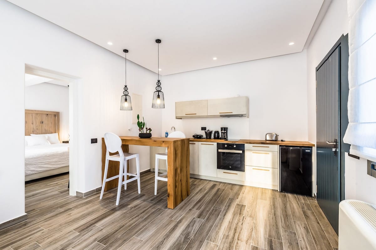 superior suite with outdoor jetted tub | private kitchenette | full-sized fridge, oven, stovetop, espresso maker