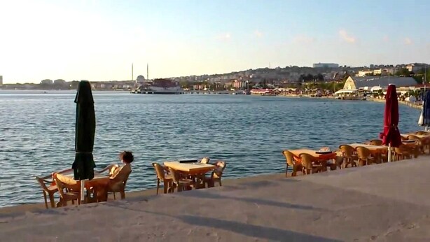 A waterfront area with tables and chairs along the edge, overlooking a body of water. - AlaDeniz Hotel (Istanbul)