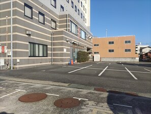 Guests can park their vehicles in the well-maintained parking area adjacent to the building.