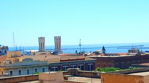 Experience the charm of a traditional Mediterranean city with stunning views of the sea and historic architecture.