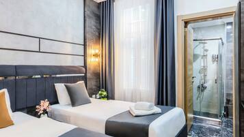 Premium bedding, free minibar items, in-room safe, desk