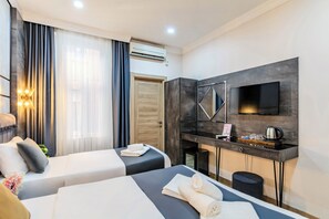 Deluxe Triple Room | 1 bedroom, premium bedding, free minibar items, in-room safe