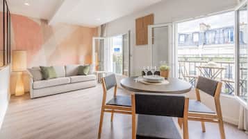 1 Bedroom Apartment with Balcony - City View - 38m2 | Living area | Flat-screen TV, tablet
