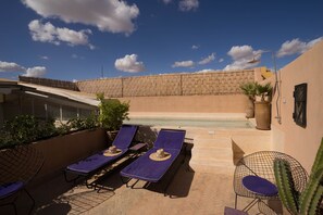 Outdoor pool, a heated pool, pool umbrellas, sun loungers