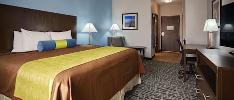 Camas con pillow-top, escritorio y tabla de planchar con plancha