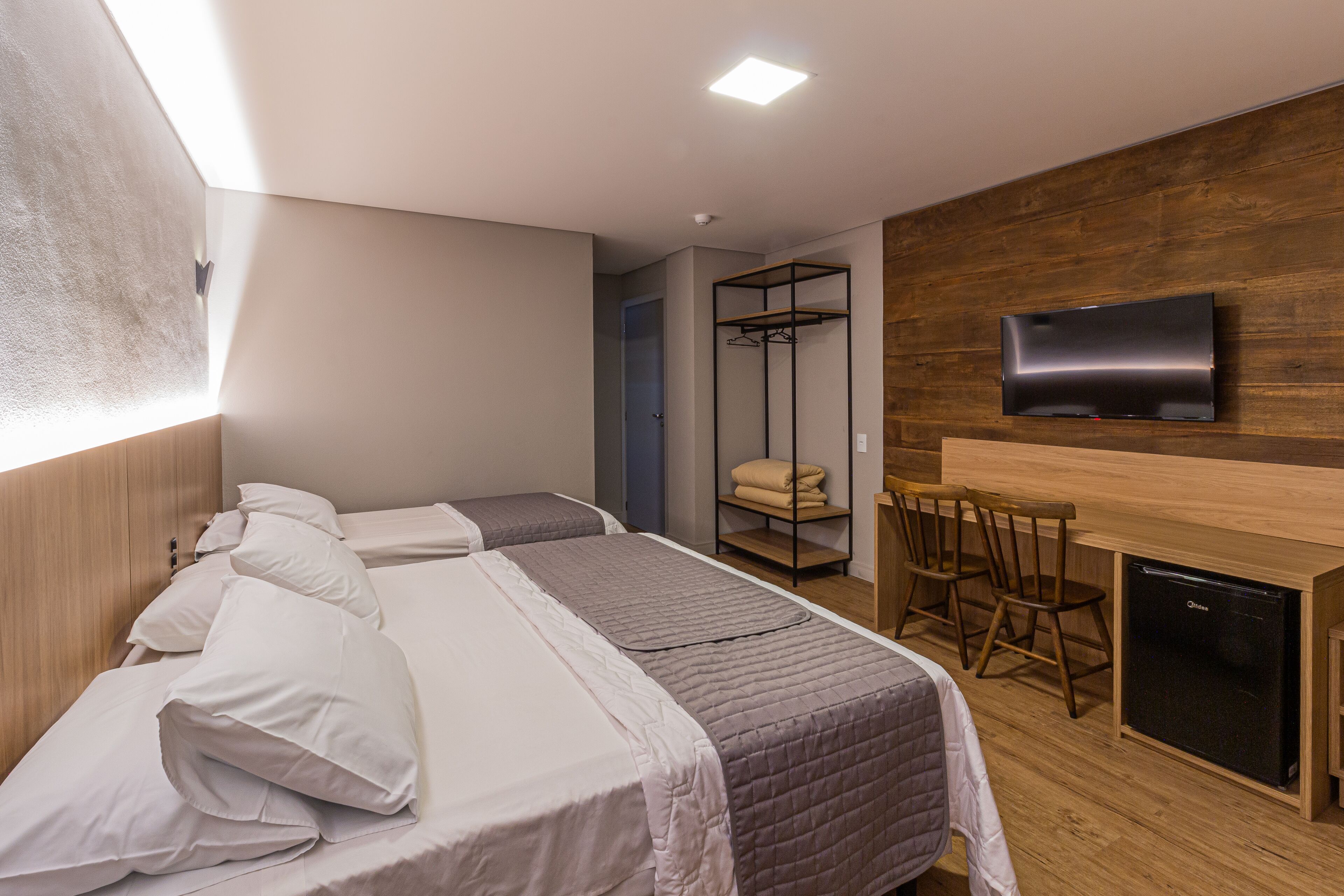 standard triple room | minibar, individually decorated, desk, blackout curtains