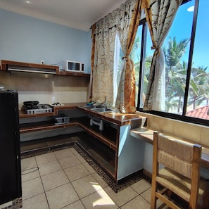 Habitación doble, cocina, vista al océano | Cocina privada