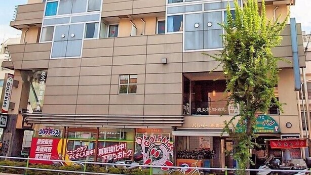 A multi-story building with a modern architectural design, featuring a mix of glass and concrete facades. - Palette Takashimadaira - Hostel (Tokyo)
