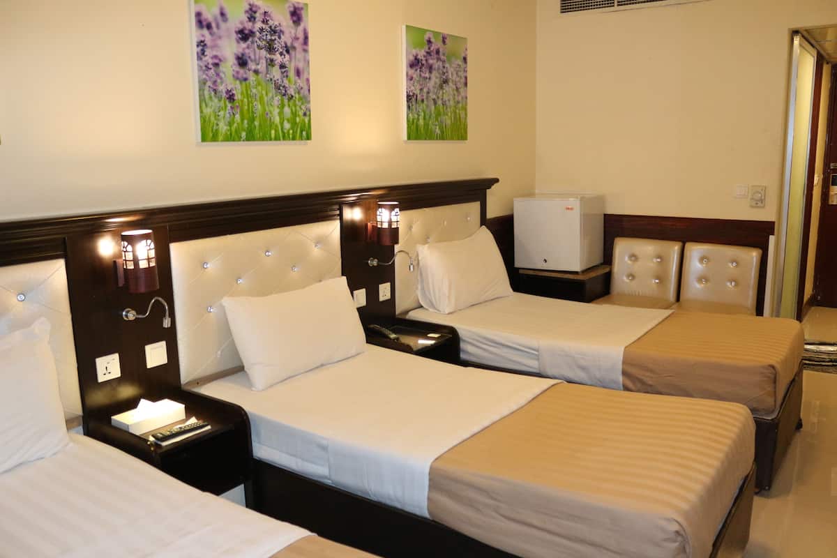 Standard Triple Room | Minibar, in-room safe, desk, blackout drapes