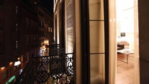 A balcony with wrought iron railings overlooking a city street at night. - Pera Residence (Istanbul)