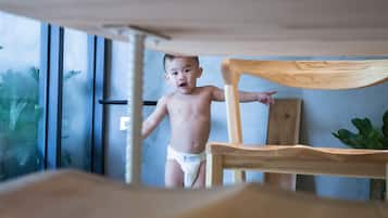 Children can play under the chair, with a window offering a view.