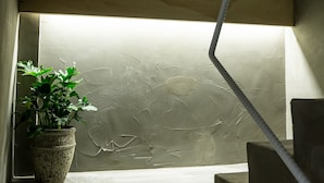 A staircase with a potted plant on the landing. - Shao Guang 188 (Yuchi)