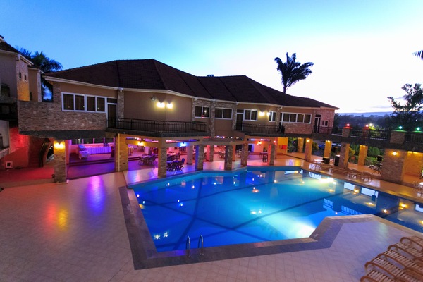 Outdoor pool, pool umbrellas, lifeguards on site