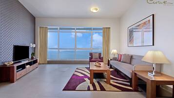 Premier Apartment, 1 Bedroom | Living area | 40-inch TV with satellite channels, iPod dock