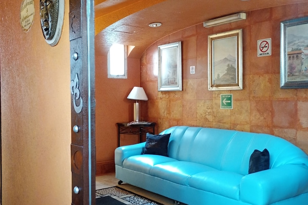 Traditional Double Room | Living area | 32-inch flat-screen TV with cable channels, TV, DVD player