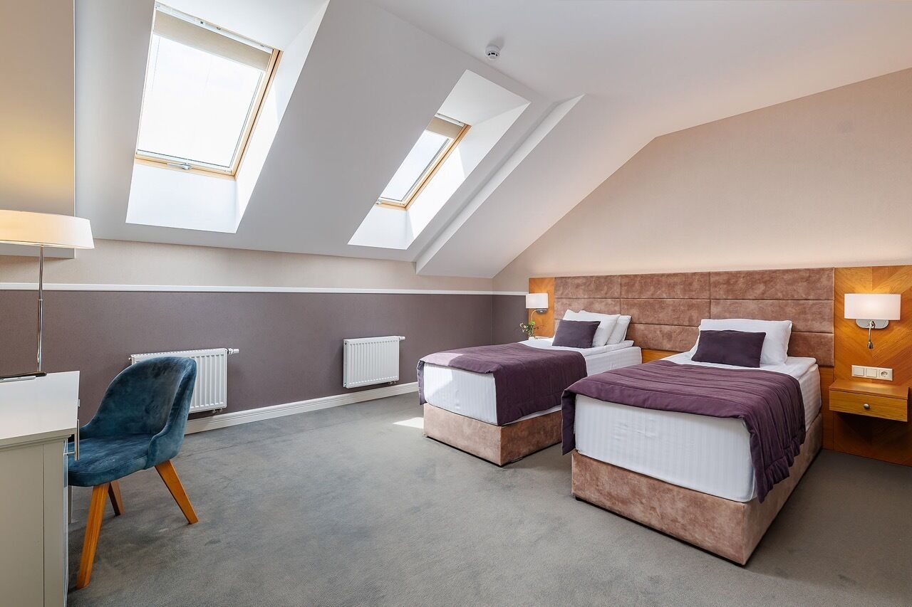 Deluxe Mansard Double | Minibar, in-room safe, individually furnished, desk