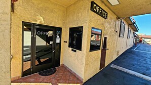 An office building with a sign reading "OFFICE" above the entrance.