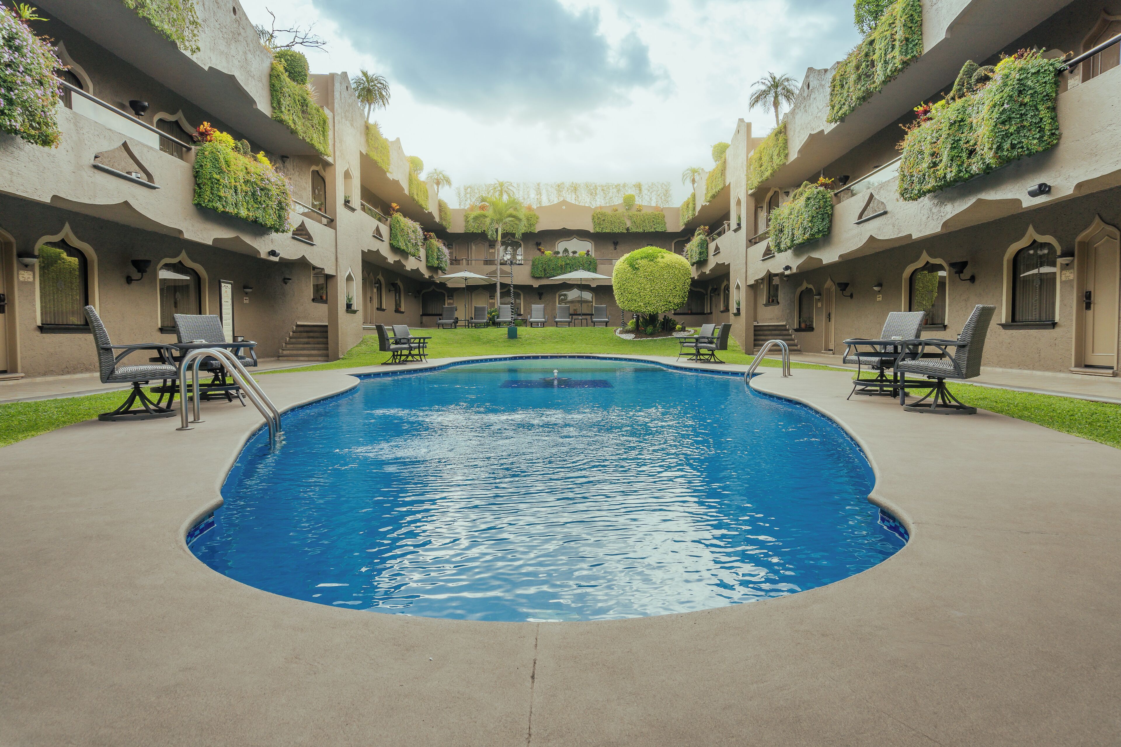 outdoor pool, open 6:00 am to 9:30 pm, pool umbrellas, pool loungers