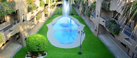 Outdoor pool, open 6:00 AM to 9:30 PM, pool umbrellas, pool loungers