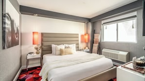 A modern hotel room with a large bed, two bedside tables, a radiator, and a window with a view. - Lexen Hotel- Hollywood Walk of Fame/Universal Studios (Los Angeles)