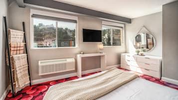 Premium bedding, blackout curtains, iron/ironing board, free WiFi