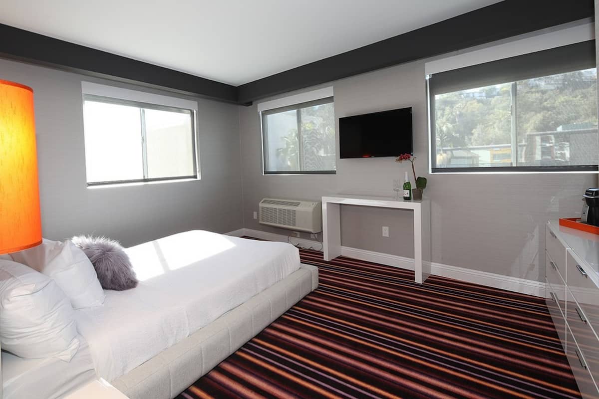 Premium bedding, blackout curtains, iron/ironing board, free WiFi