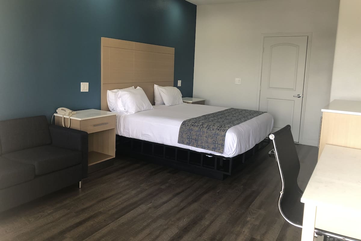 Deluxe Room, 1 King Bed (Second Floor Only) | Tempur-Pedic beds, individually decorated, individually furnished, desk