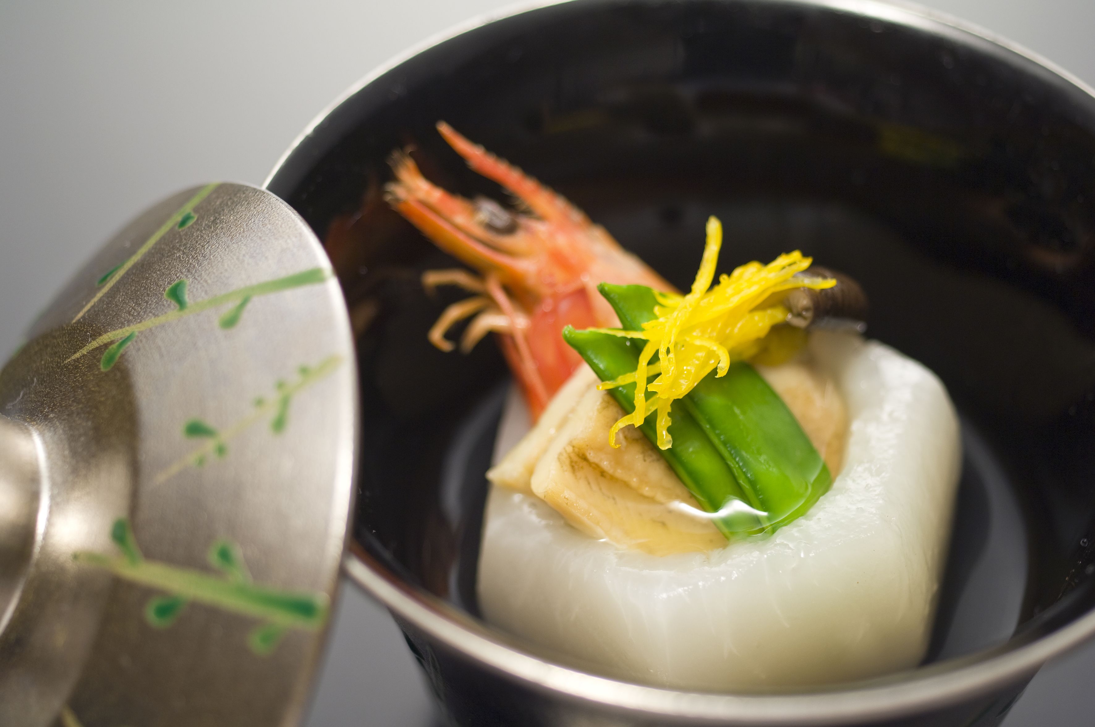 A bowl of food with a spoon.