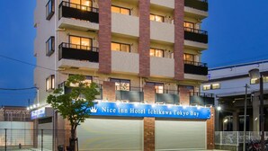 A multi-story hotel with a prominent sign reading "Nice Inn Hotel Ichikawa Tokyo Bay." - Nice Inn Hotel Ichikawa Tokyo Bay (Ichikawa)