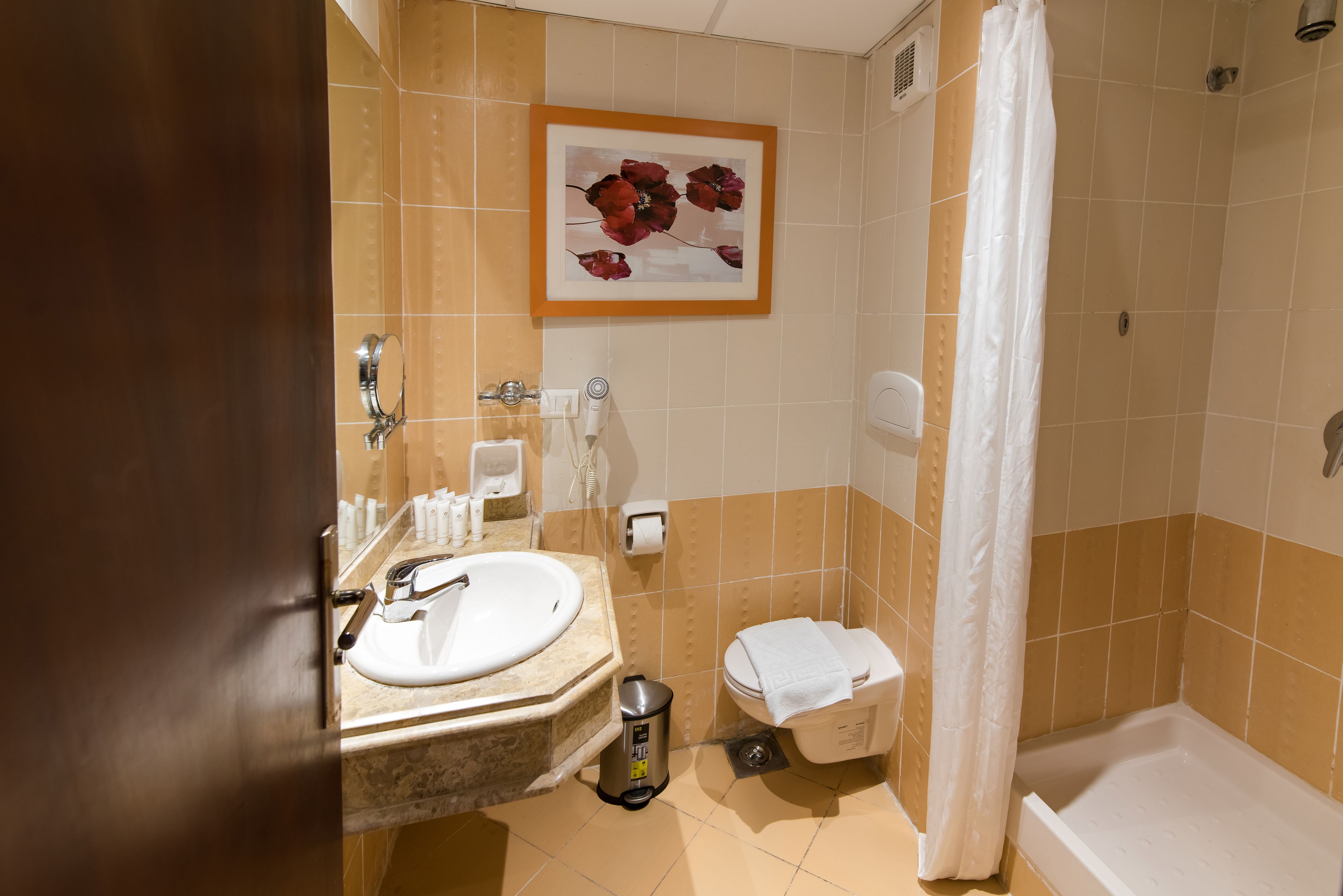 shower, free toiletries, slippers, towels