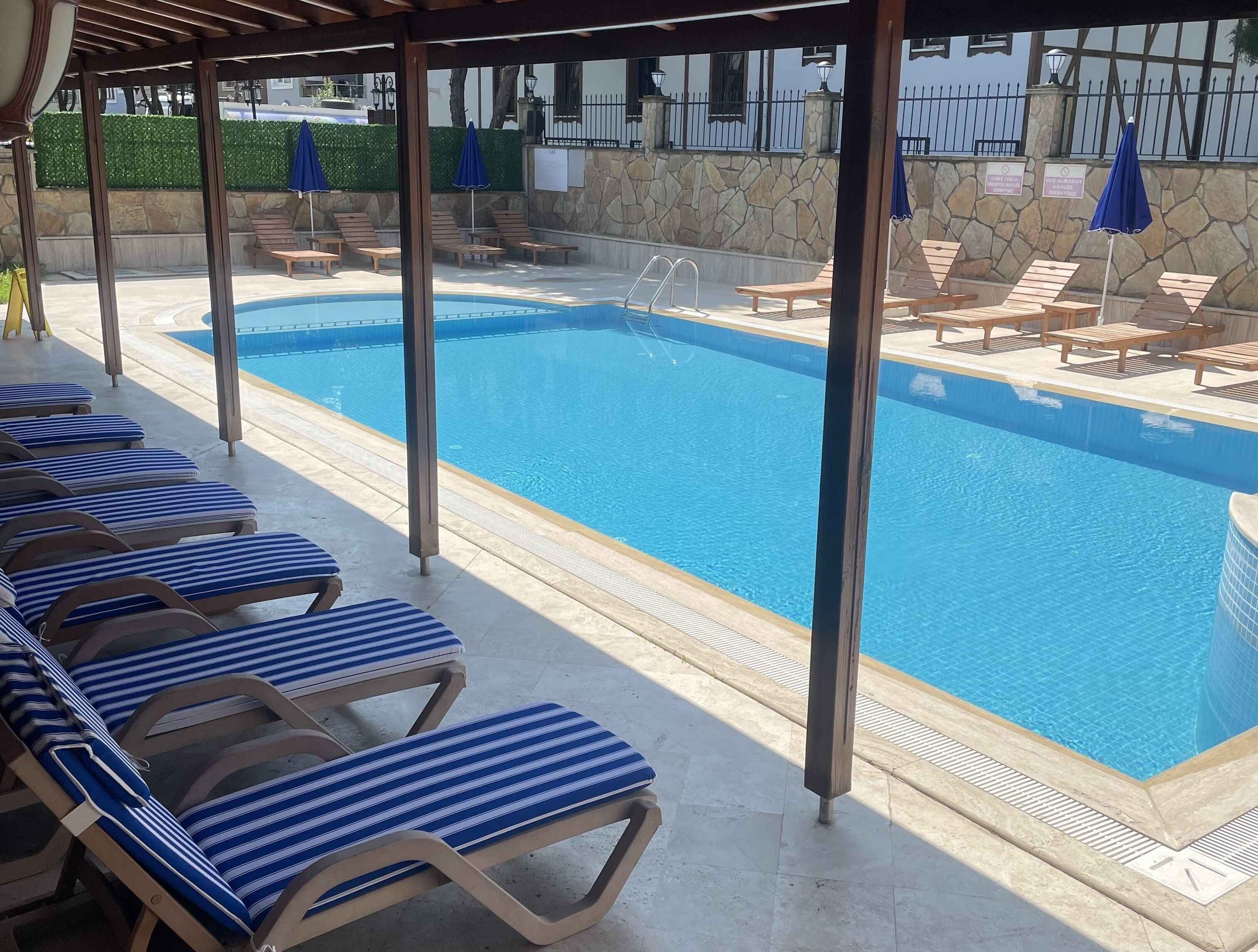 outdoor pool, pool umbrellas, pool loungers