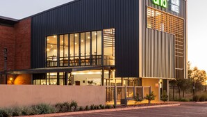A modern building with a large glass facade, a prominent 'onda' sign, and a 'KATHU HOTEL' sign above. - Urban Hotel Kathu (Kathu)