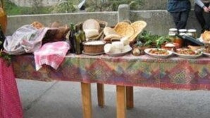 A table set with various dishes and a bottle, likely for a meal or event. - B&B Shalom (Condofuri)