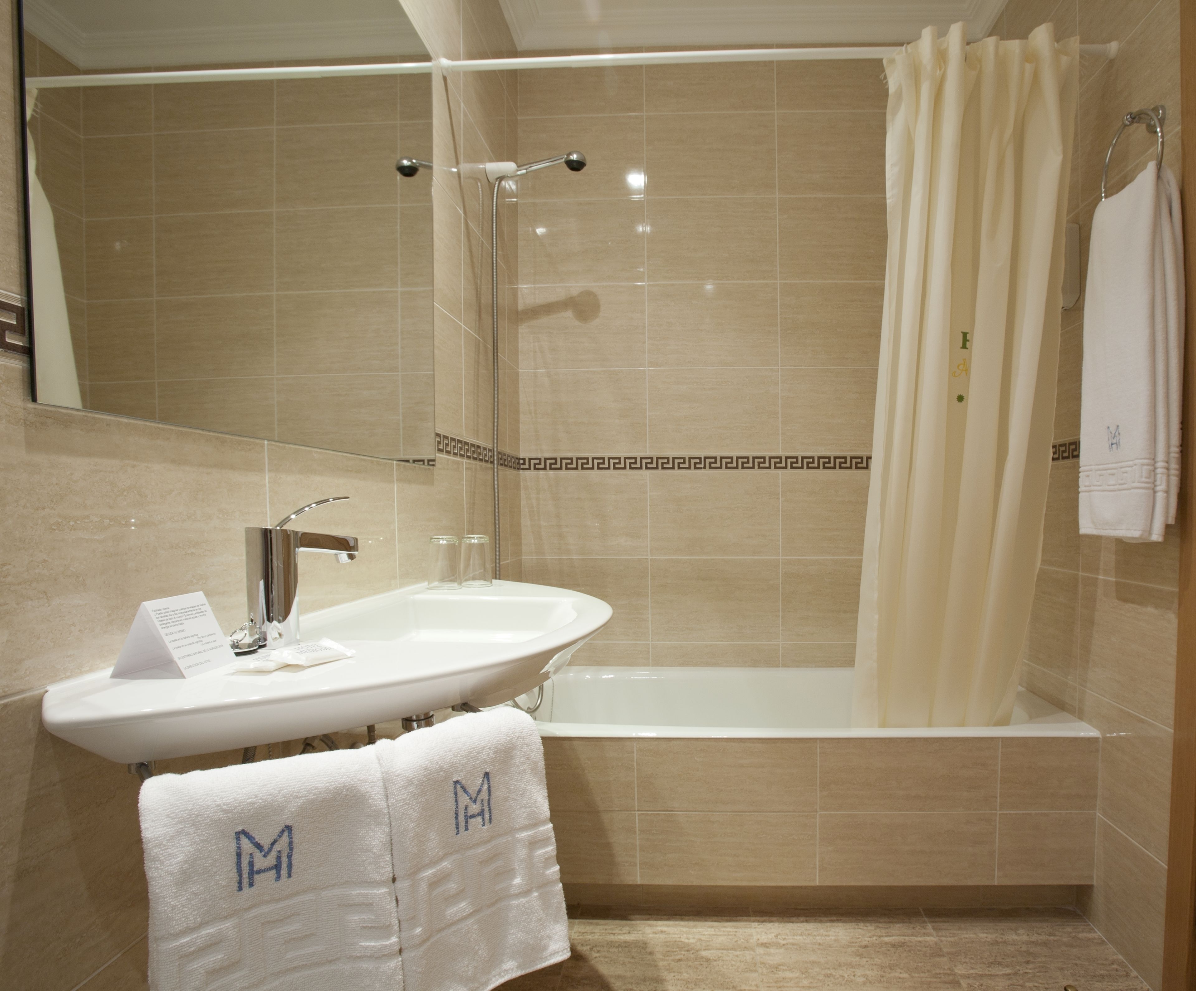 eco-friendly toiletries, hair dryer, towels