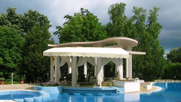 A pool area with a gazebo, surrounded by lush greenery. - Villa Bellevue -Golden Sands Nature Park (Golden Sands)