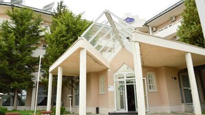 A building with a glass entrance, beige exterior, and a sign reading "Bellevue". - Villa Bellevue -Golden Sands Nature Park (Golden Sands)