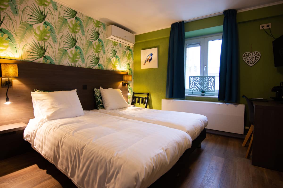 standard twin room | desk, laptop workspace, blackout curtains, iron/ironing board