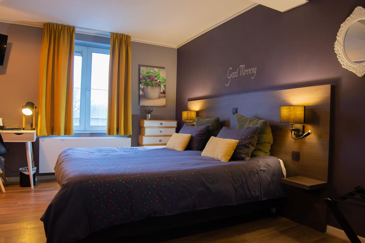 deluxe double room | desk, laptop workspace, blackout curtains, iron/ironing board