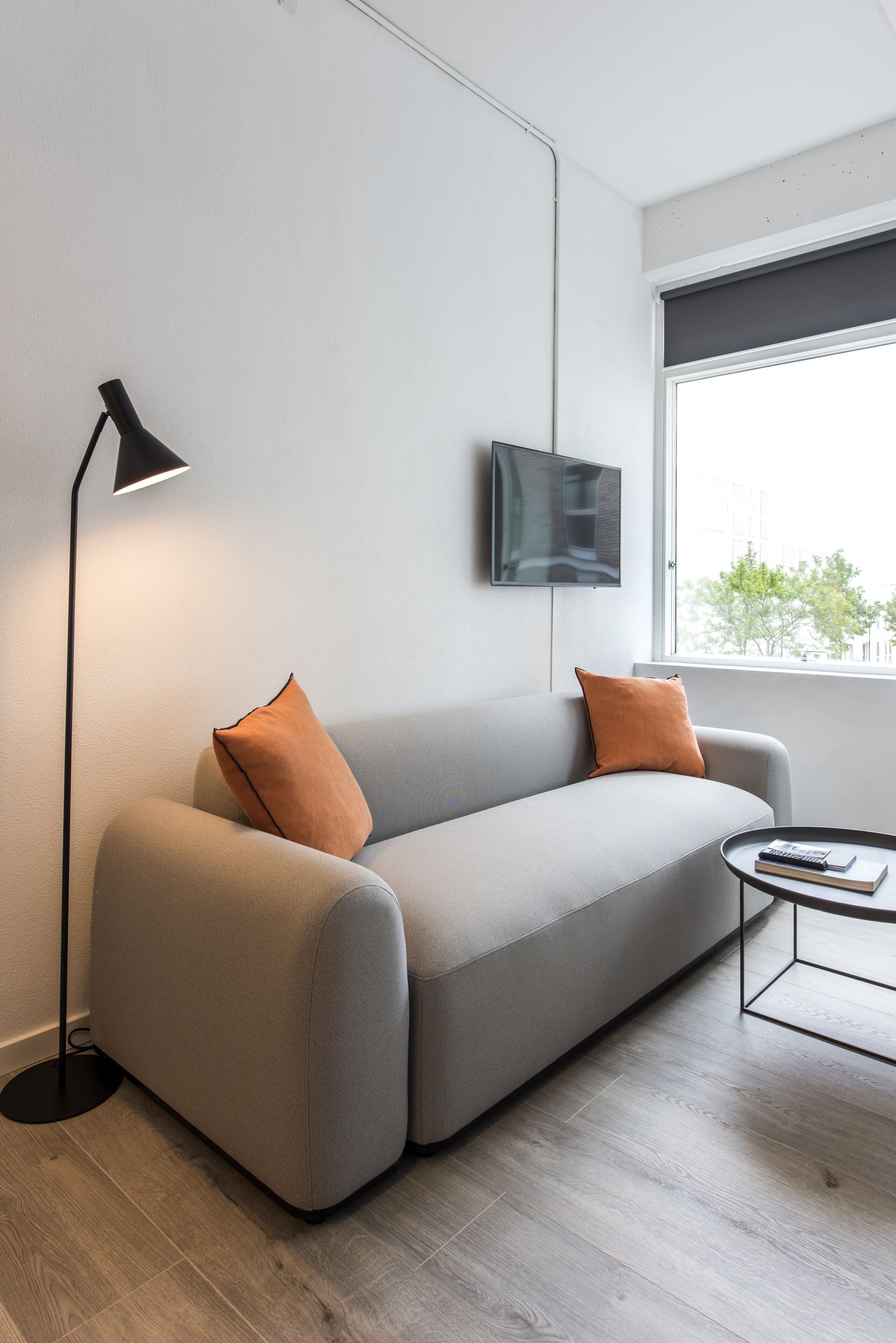 twin room, kitchenette | living area | flat-screen tv, heated floors