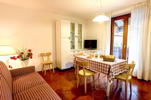 Apartment, 1 Bedroom | Living area | TV