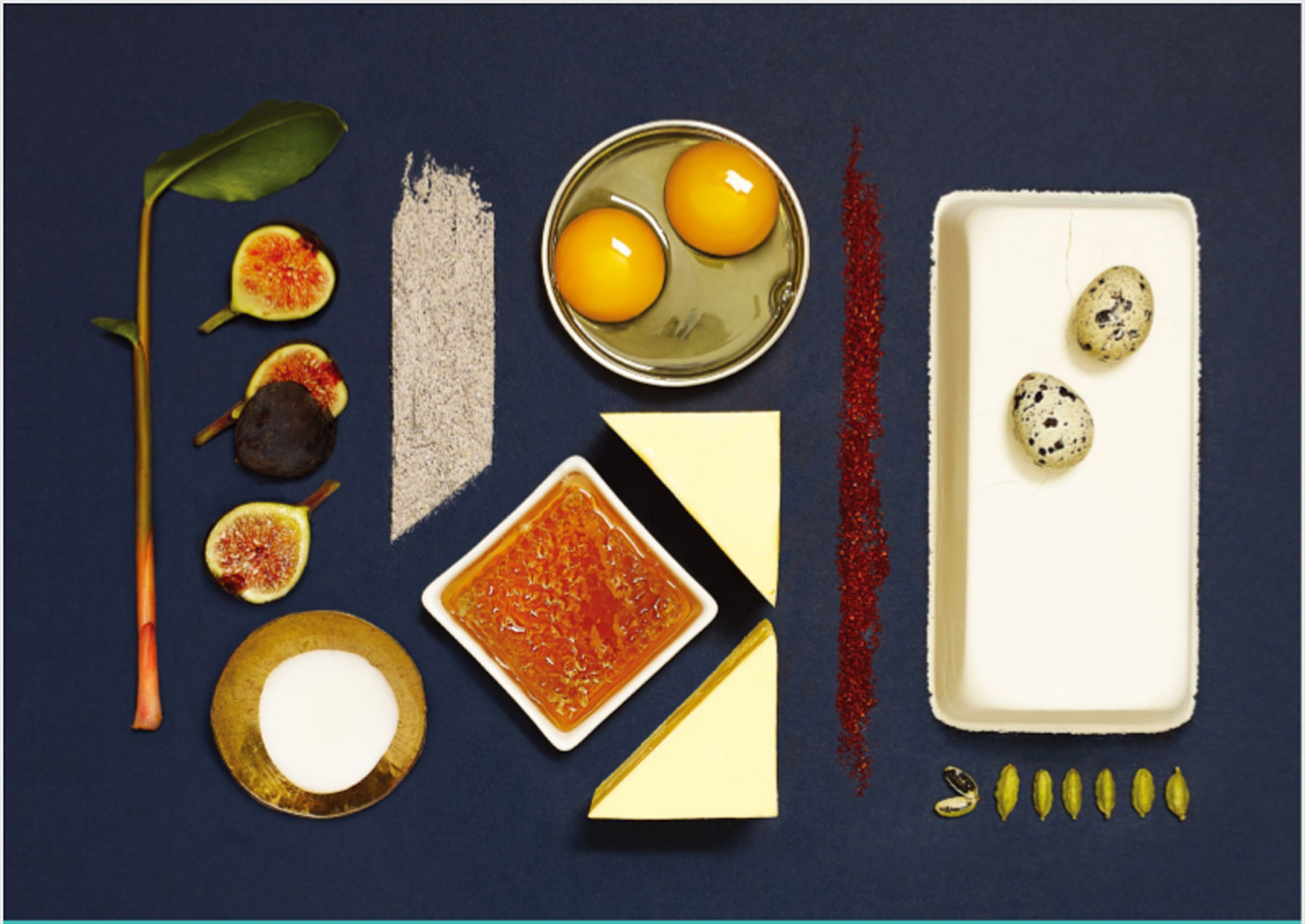 A variety of food items and ingredients on a dark surface.