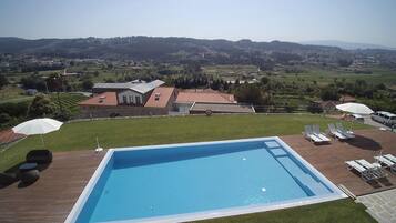 Seasonal outdoor pool, pool umbrellas, pool loungers